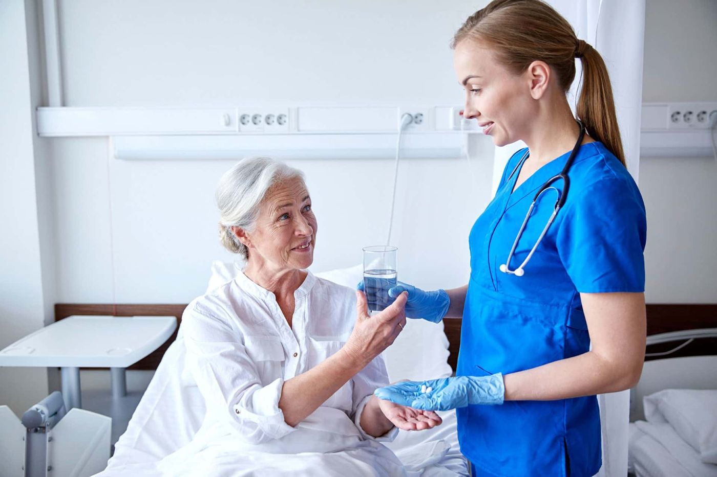 Nurse caring for an elderly patient